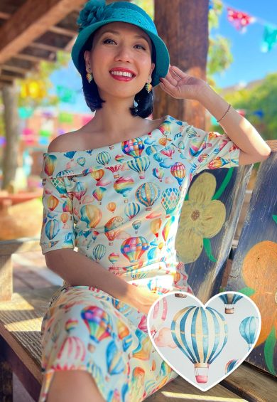 Valerie Fitted Off-the-Shoulder Vintage Dress in Hot Air Balloon Festival Print – Shop now at Kitty Darling
