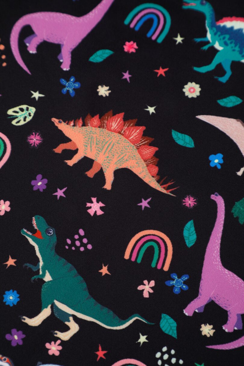 Aisley Dinosaur Pleated Midi Skirt In Black  Shop now at Kitty Darling