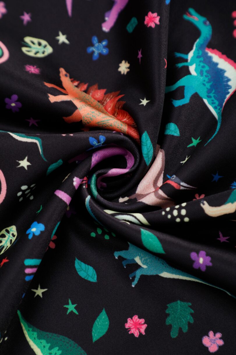 Aisley Dinosaur Pleated Midi Skirt In Black  Shop now at Kitty Darling