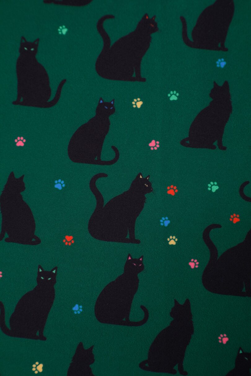 Aisley Black Cat Pleated Midi Skirt In Green  Shop now at Kitty Darling